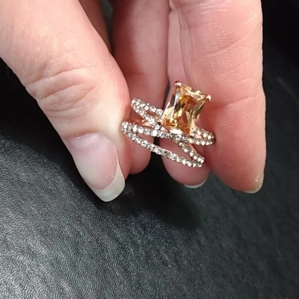 Rose gold colored ring with champagne stone Size 6